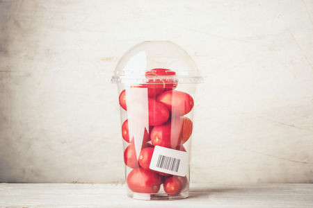 Tomatoes in the plastic package horizontalの写真素材