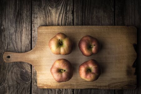 Red apples on a cutting board horizontalの写真素材