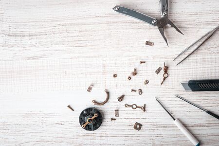 Tools and disassembled mechanism on the desktop horizontalの写真素材