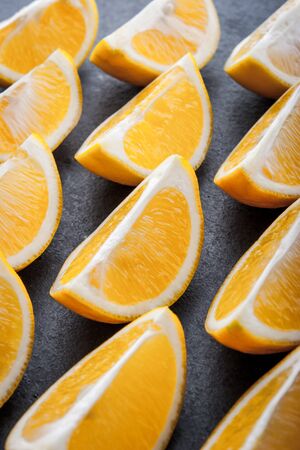 Yellow lemons on a blue stone table horizontalの写真素材