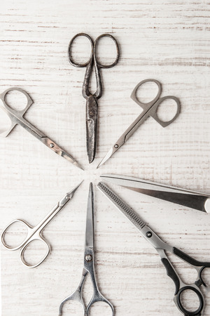 Set of scisSet of scissors on a wooden table horizontalsorsの写真素材