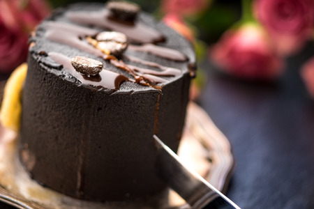 Coffee mousse and a bouquet of roses on a blue table horizontalの写真素材