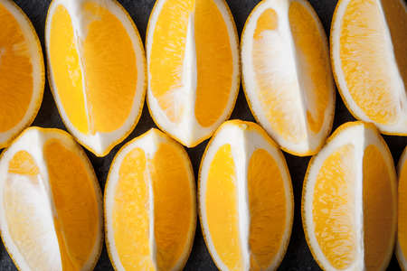 Arrangement of yellow lemon slices horizontalの写真素材