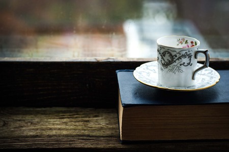 Coffee cup  with old bookの写真素材