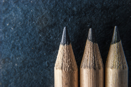 Pencils on the dark stone  background  close-upの写真素材