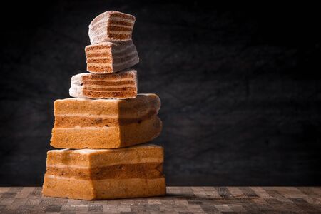 Pyramid of pastila pieces on the wooden table horizontalの写真素材