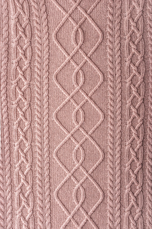 Pink figured sweater background verticalの写真素材