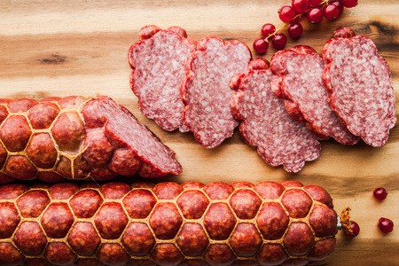 Sausage with  current  on the wooden board