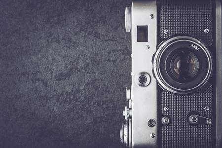 Old camera on the stone background black and white top viewの写真素材