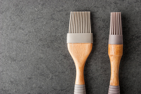 Cooking brush on the  stone tableの写真素材