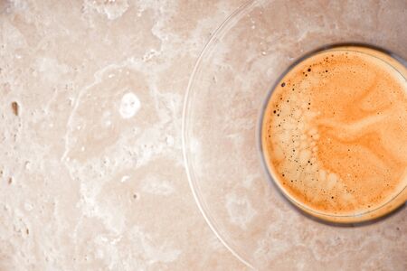 Cup of coffee on the stone tableの写真素材