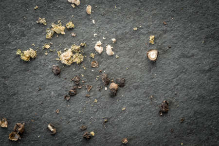 Crushed  peppers  on the black  stone table top view