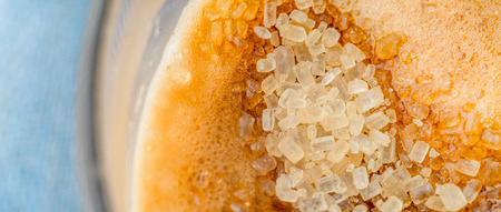 Coffee with sugar background close - up
