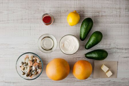 Ingredients for Salad with avocado and seafood horizontal