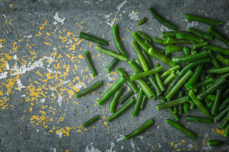 Pods of beans on a metal background horizontal