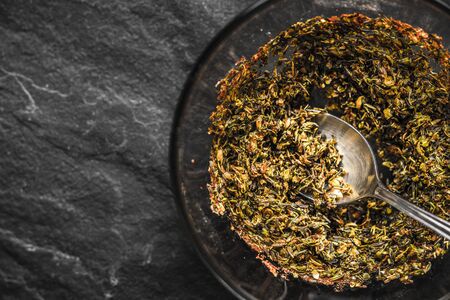 Mixture of spices and olive oil in glass bowlの写真素材