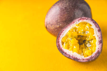 Passion fruit on the yellow background horizontalの写真素材