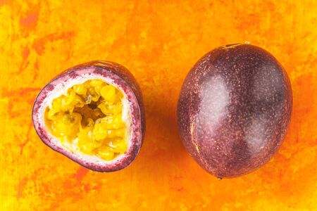 Passion fruit on the terracotta background top viewの写真素材