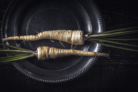 Parsley root  on the old metal plate  top viewの写真素材