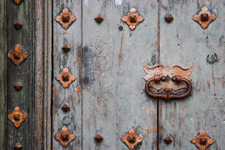 Old wooden door with metal decor background