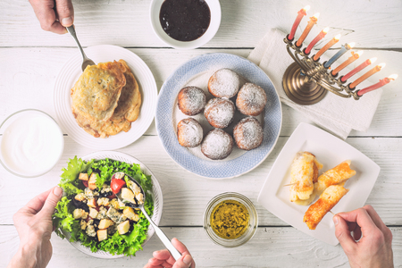 Hanukkah dinner with traditional dishes horizontalの写真素材