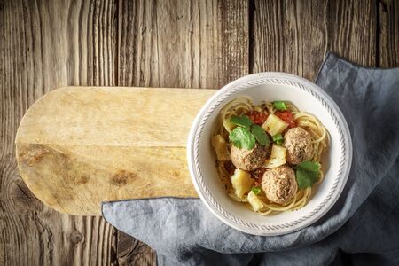 Ready-made spaghetti and meatballs at the board horizontalの写真素材
