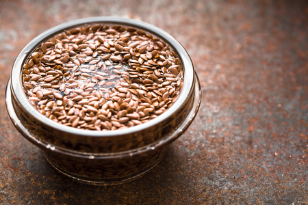 Glass bowl with flax seeds in the water  horizontalの写真素材
