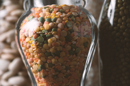 Lentils, rice, large white beans in glass jars closeupの写真素材