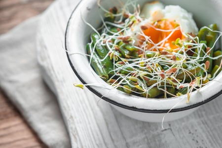 Salad with beans, sprouted flax and quail eggs side viewの写真素材