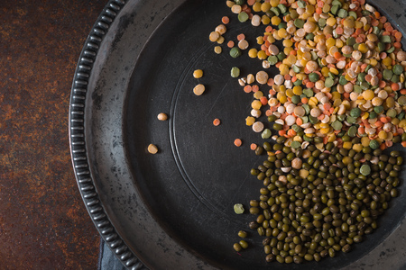 Placer lentils on a pewter plate on the tableの写真素材