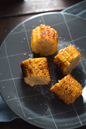 Large pieces of fried corn on ceramic plateの写真素材