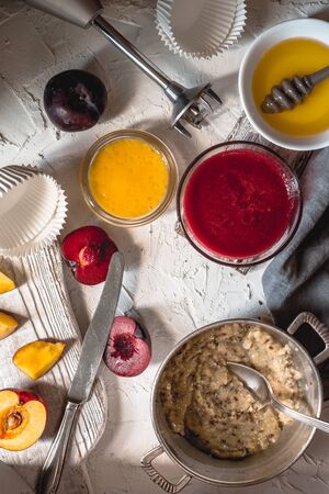 Ingredients and peanut butter on a wooden tableの写真素材