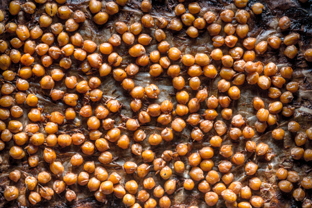 Nut in caramel crust on parchment on a baking sheet close-upの写真素材