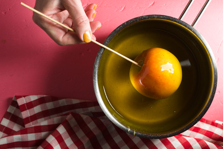 Soy with sugar syrup, apple on stick top viewの写真素材
