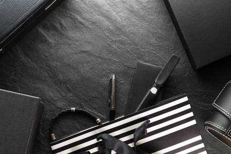 Frame from the package with a black bow and with gifts, different boxesの写真素材