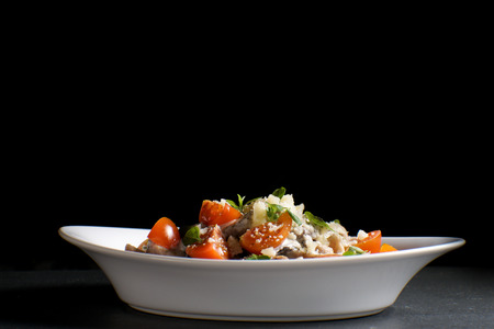 Italian pasta with cheese, cherry and basil. Free spaceの写真素材