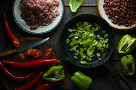 Ingredients for fajita and a knife on a cutting board.の写真素材