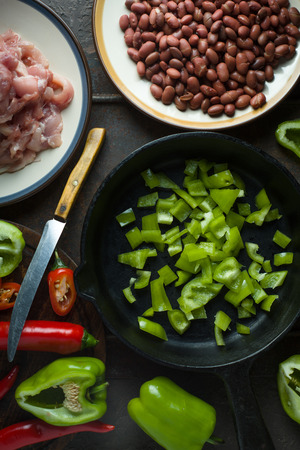 Ingredients for fajita and a knife on a cutting board.の写真素材