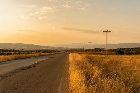 Mountains road and fields in Greeceの写真素材