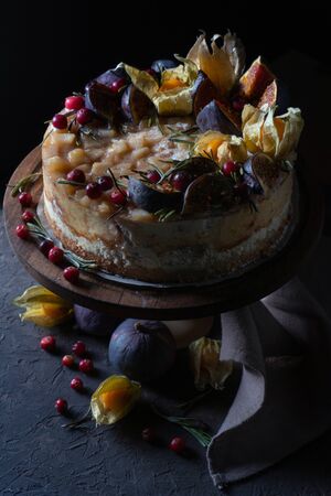 Cheesecake with fruit on a holder and with a napkinの写真素材