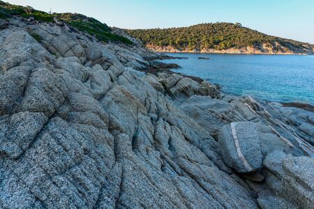 Grey stones Peninsula and the sea in Greece horizontalの写真素材