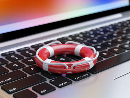 3d illustration of lifebelt on the laptop keyboard with soft focus. Computer protection conceptの写真素材
