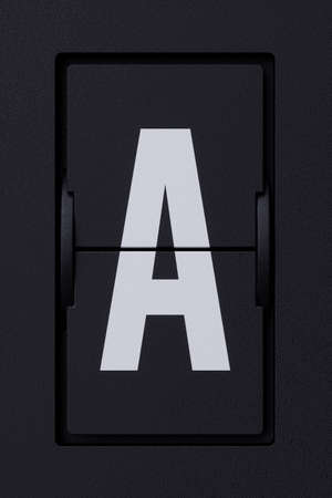 Airport mechanical flip board panel font.  Front view white ABC capital alphabet character letter A on dark background. 3d rendering illustrationの写真素材