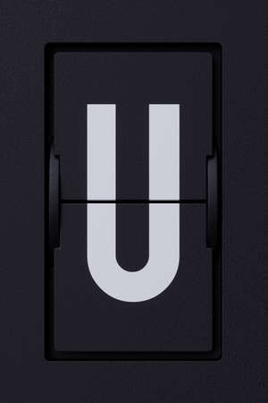 Airport mechanical flip board panel font.  Front view white ABC capital alphabet character letter U on dark background. 3d rendering illustrationの写真素材