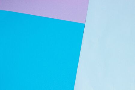 Abstract geometric flat background from colored paper. Violet and blue colored paper, template for adding text.の写真素材