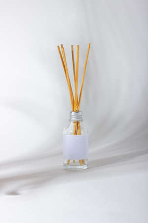 Incense sticks for the home. White background with plant shadows and aroma diffuser. Eco-friendly...