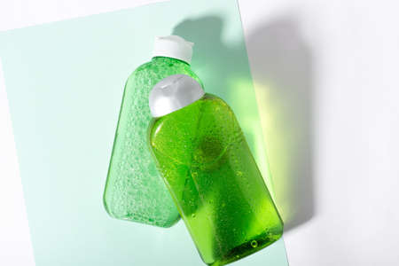 Facial cleanser bottle. Lotion or micellar water for face cleansing. Liquid cosmetic product in green packaging. Natural cosmetics conceptの写真素材