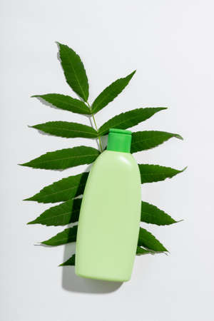 Cosmetic product in green tube with empty space for branding label.の写真素材