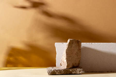 Background with geometric shapes made of concrete for cosmetic products. Rectangular podiums with shadows on a beige background. Blank mockup for product packaging presentationの写真素材