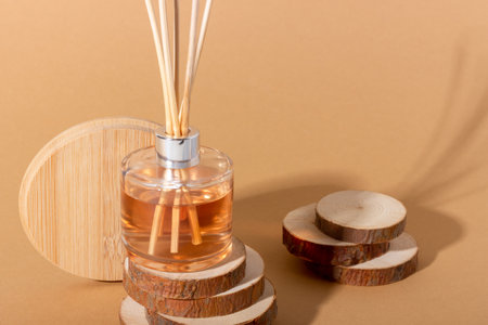 reed diffuser bottle on the podium. Incense sticks for the home with a floral scent with hard...